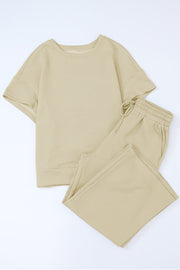 Textured knit tee and wide leg pants set in beige with a geometric pattern.