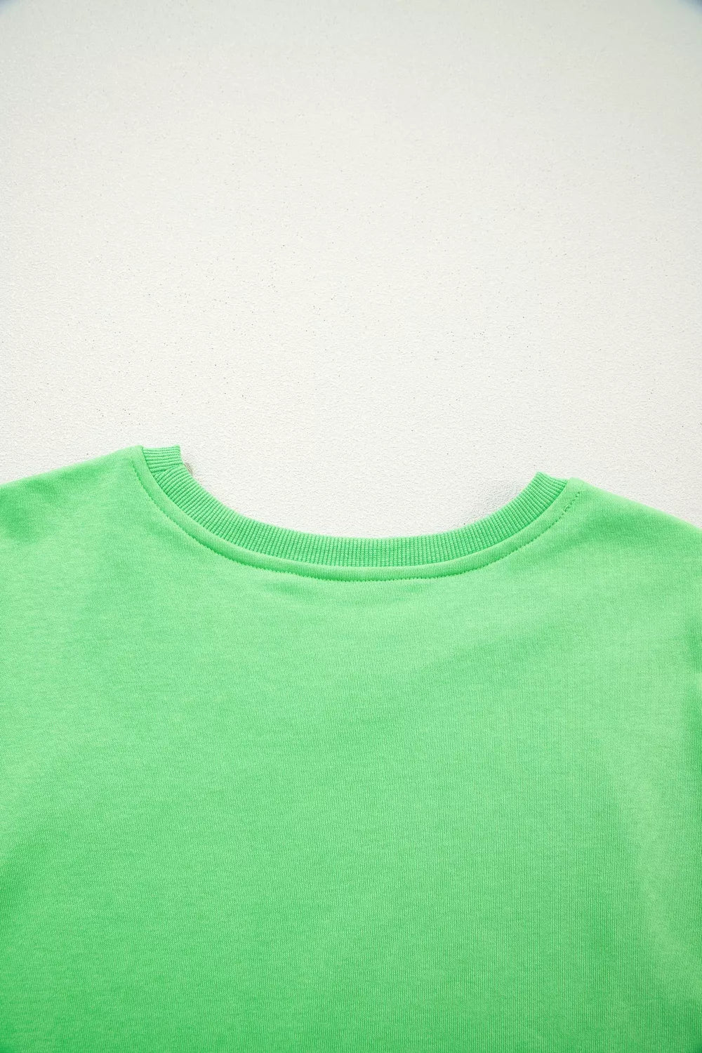 Green cotton crewneck sweatshirt with ribbed collar detail