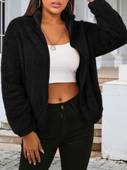 Black sherpa bomber jacket with zip-up front and stand-up collar.