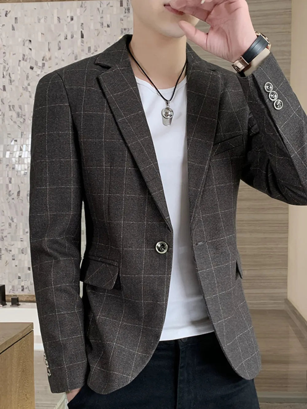 Men's mocha plaid sport jacket with button closure and notched lapel.