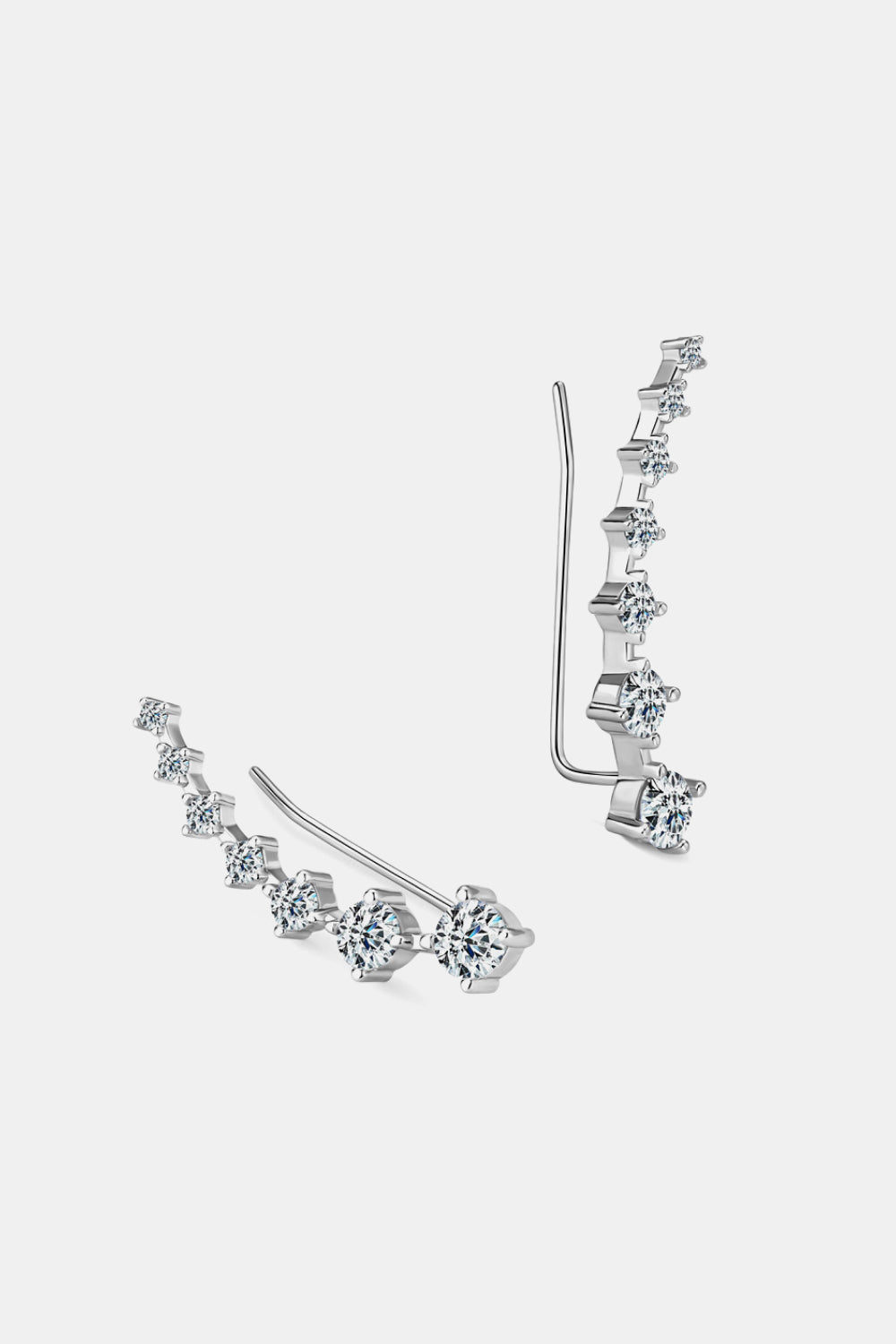 Silver ear climbers with graduated clear cubic zirconia stones.