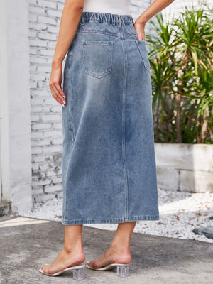 Light blue denim midi skirt with elastic waist and slit detail.