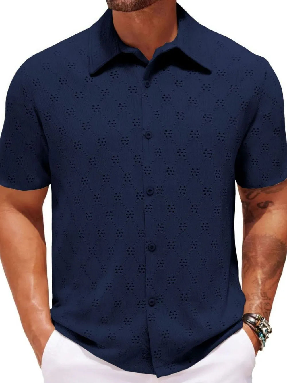 Navy geometric eyelet short sleeve resort shirt with button front and collar.
