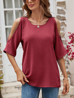 Burgundy open-shoulder textured raglan top with short sleeves.