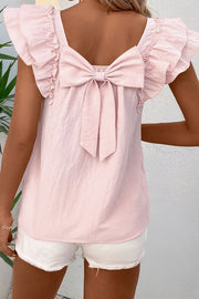 Blush pink blouse with ruffle sleeves and a large back bow detail.
