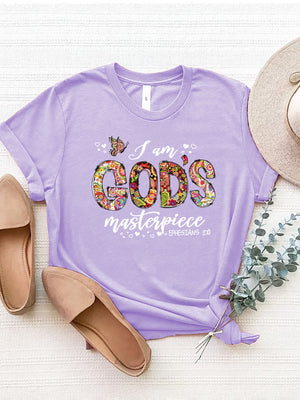 Lavender t-shirt with floral typography graphic saying I am God's masterpiece.