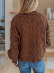 Oversized caramel cable knit turtleneck sweater with ribbed cuffs and hem.