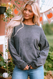 Textured ribbed crewneck pullover sweater in dark gray with long sleeves and a relaxed fit.