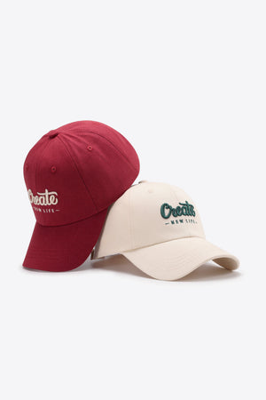 Deep Red and Ivory baseball caps with embroidered "Create New Life" text.