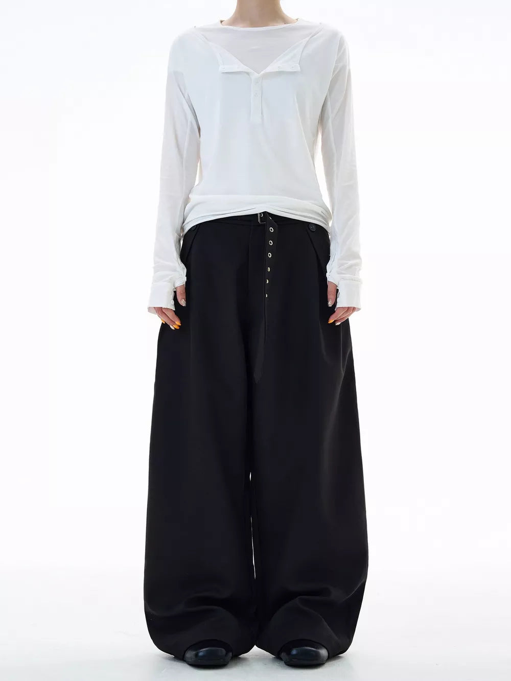 Black plus size wide-leg sweatpants with button details and a belted waist.