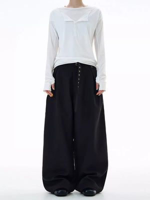 Black plus size wide-leg sweatpants with button details and a belted waist.