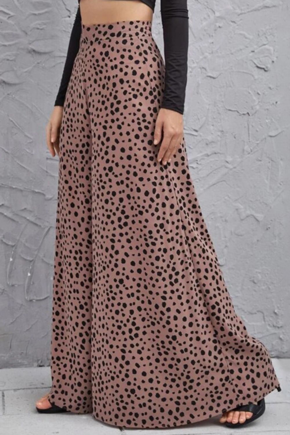Spotted wide-leg palazzo trousers in dusty pink with a black animal print.
