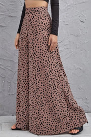 Spotted wide-leg palazzo trousers in dusty pink with a black animal print.