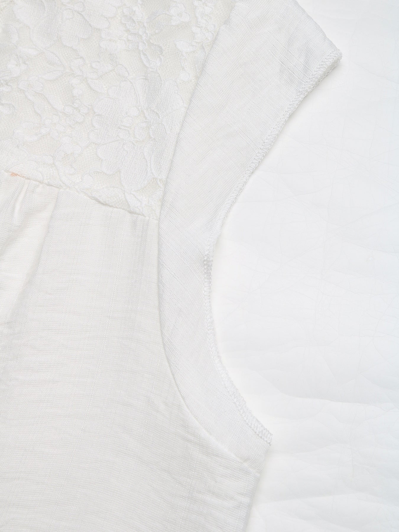 White maternity blouse with lace yoke detail and cap sleeves