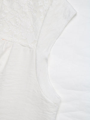 White maternity blouse with lace yoke detail and cap sleeves