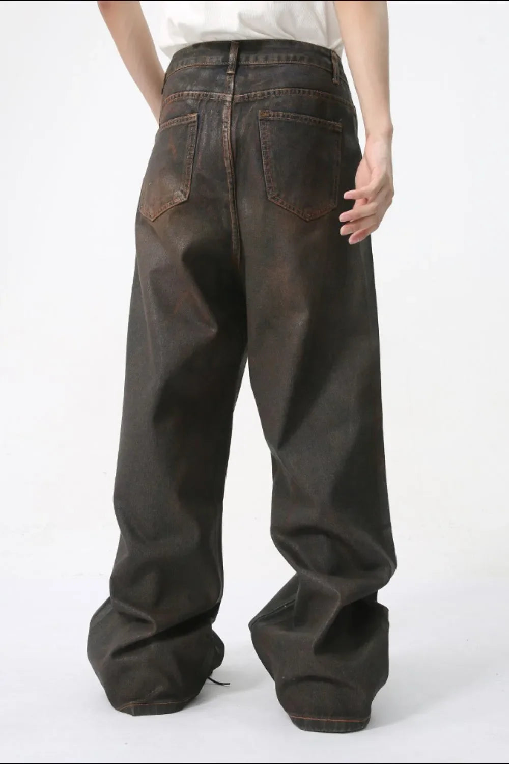 Faded oversized denim jeans in dark wash with a relaxed fit.