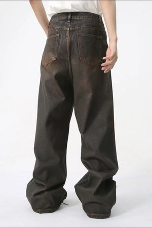 Faded oversized denim jeans in dark wash with a relaxed fit.
