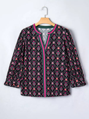 Black cotton blouse with pink floral print, bracelet sleeves, and contrast trim.