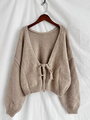 Textured tie-front knit cardigan in khaki with a deep V-neck and balloon sleeves.