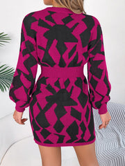 Geometric knit mini dress in deep rose with black abstract pattern, long sleeves, and cinched waist.