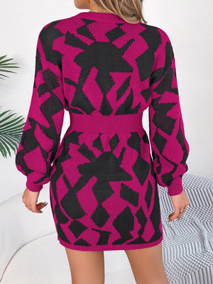 Geometric knit mini dress in deep rose with black abstract pattern, long sleeves, and cinched waist.