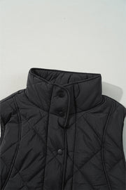 Black quilted vest with stand collar and snap closure