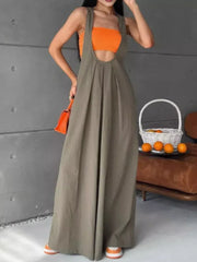 Army green pleated overall maxi dress with wide straps and a cutout bodice.