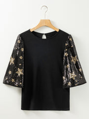 Black knit top with sequin star sleeves
