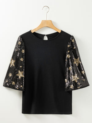 Black knit top with sequin star sleeves