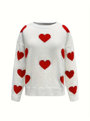 White oversized knit crewneck sweater with all-over red heart pattern and drop sleeves.