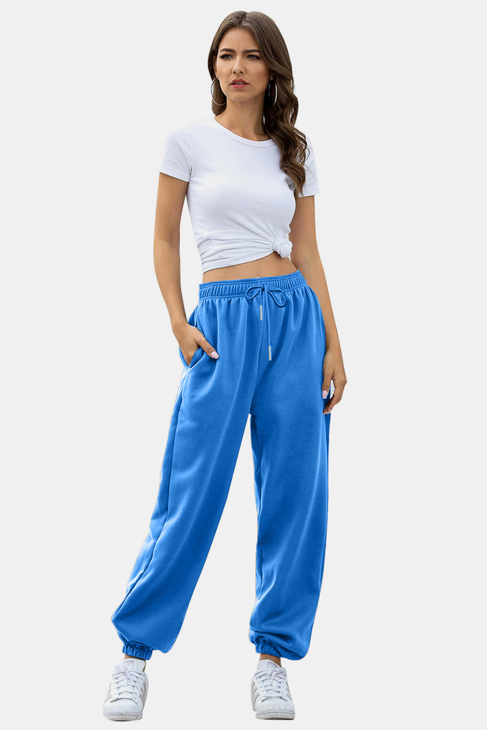 Blue slouchy sweatpants with gathered cuffs and drawstring waist.