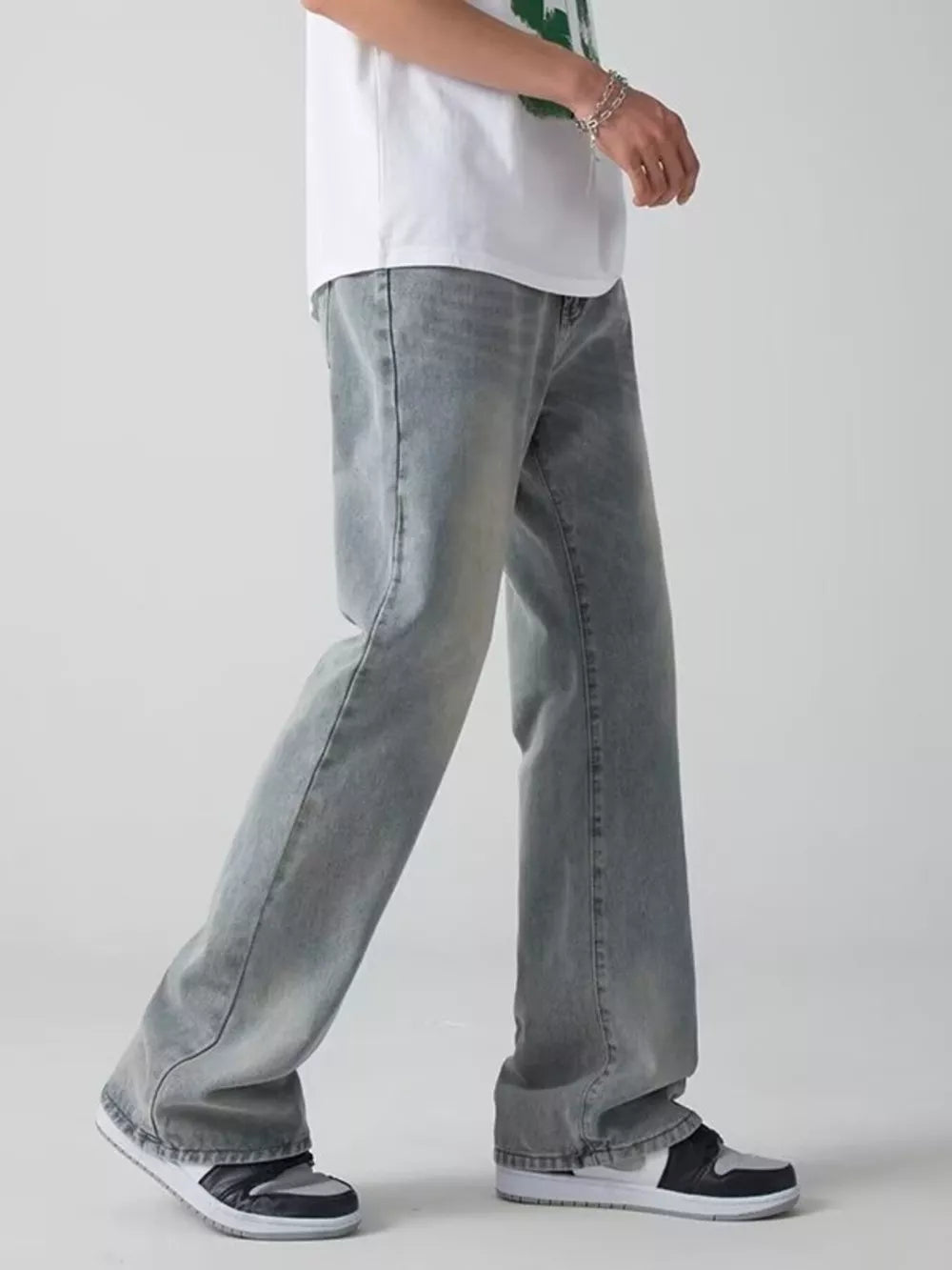Men's light wash wide-leg jeans with a relaxed fit.