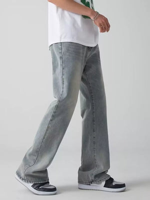 Men's light wash wide-leg jeans with a relaxed fit.