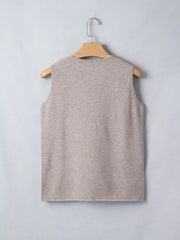 Beige V-neck knit vest with star embellishments, sleeveless acrylic.