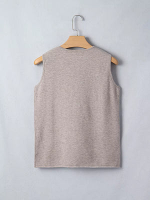 Beige V-neck knit vest with star embellishments, sleeveless acrylic.