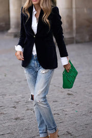 Chic black velvet bolero jacket with a single button closure and notched collar.