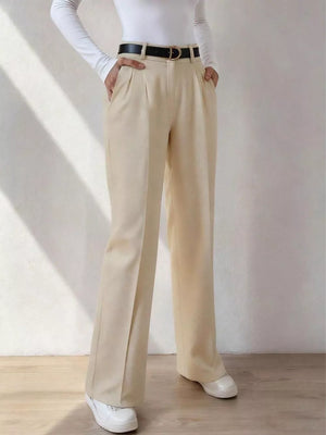 Beige wide-leg dress pants with pockets and belt loops, styled with a black belt.