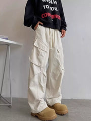 Relaxed fit apricot cargo pants with drawstring and multi pockets.