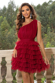 Red tulle ruffle one-shoulder mini dress with a cinched waist and tiered skirt.