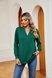 Henley-inspired long sleeve top in dark green with buttoned V-neck, casual fit