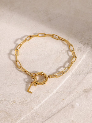 Gold chunky chain bracelet with toggle clasp and initial L charm