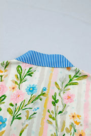 Floral print shift dress with blue striped collar and button-down detail.