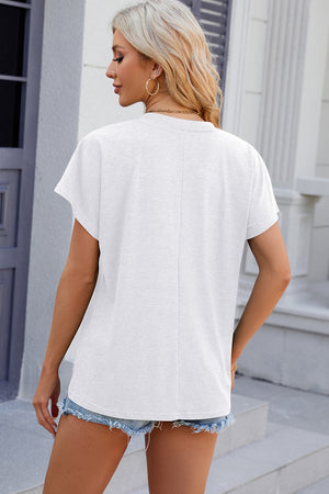 White dolman sleeve slouchy v-neck top with a relaxed fit