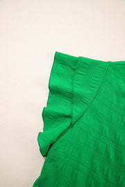 Green textured blouse with ruffle sleeves and crew neck detail.