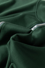 Dark green funnel neck romper with drawstring waist and zipper detail