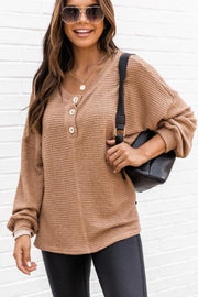 Waffle knit henley pullover in camel with button detail and v-neck.