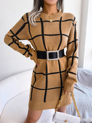 Khaki geometric grid knit mini dress with long sleeves and crew neck, styled with a black belt.