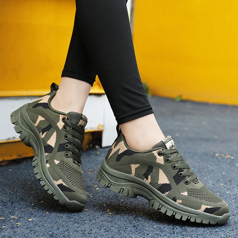 Camouflage mesh performance trainers in moss green with lace-up closure and thick soles.