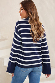 Navy and white striped knit sweater with mock neck and bell sleeves.