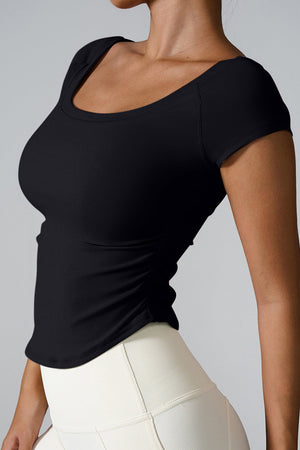 Black performance tee with gathered side detail and scoop neck